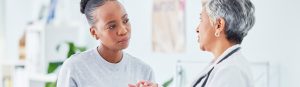 female physician provides information to female patient